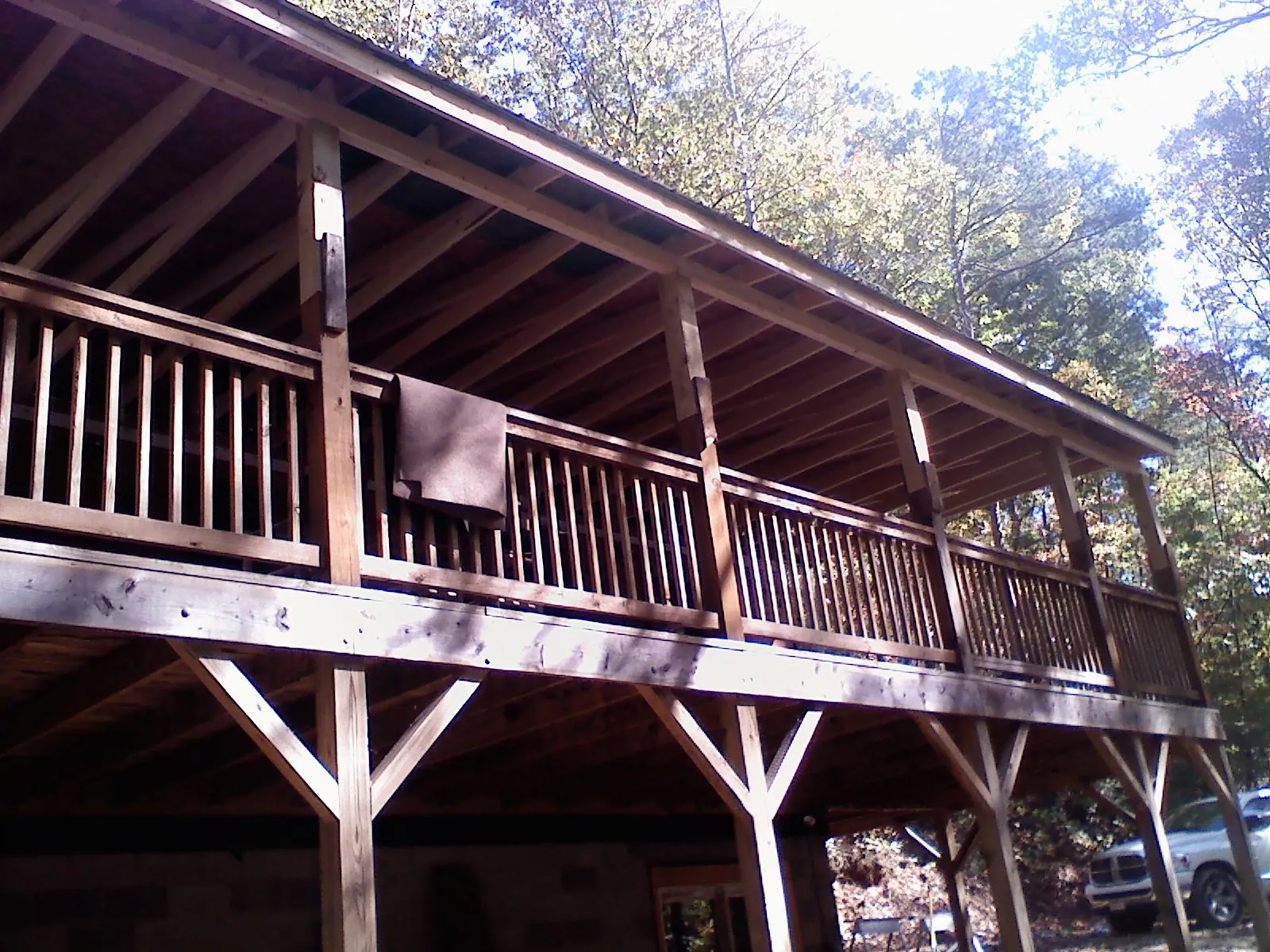 Timber framing under a new elevated porch and deck — Roof Leak Repair in Pomfret Center by Roofing Brothers